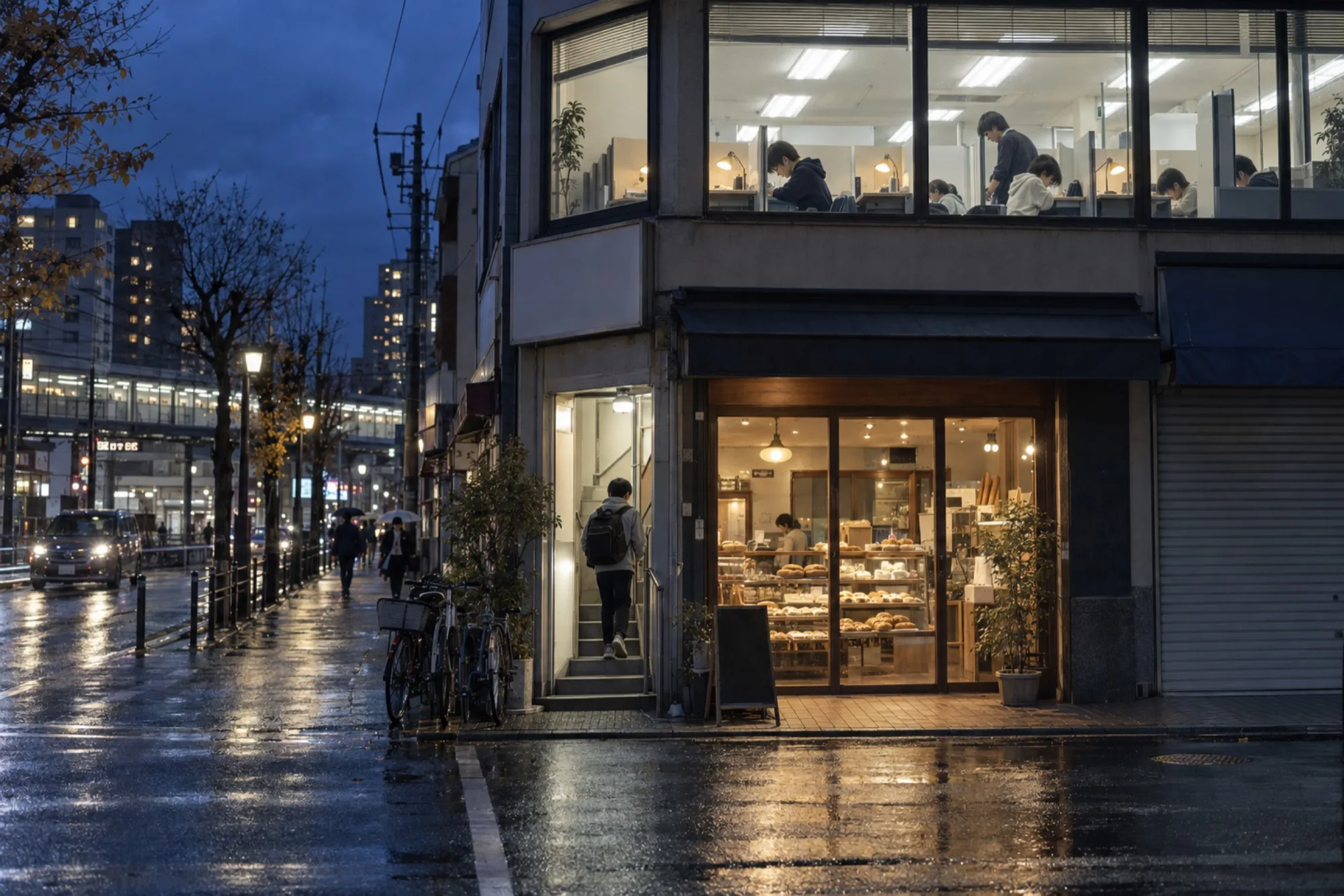 雨上がりの夜、駅前のパン屋の2階で明かりのついた塾の窓と、入口に向かう中学生（写真は見本）